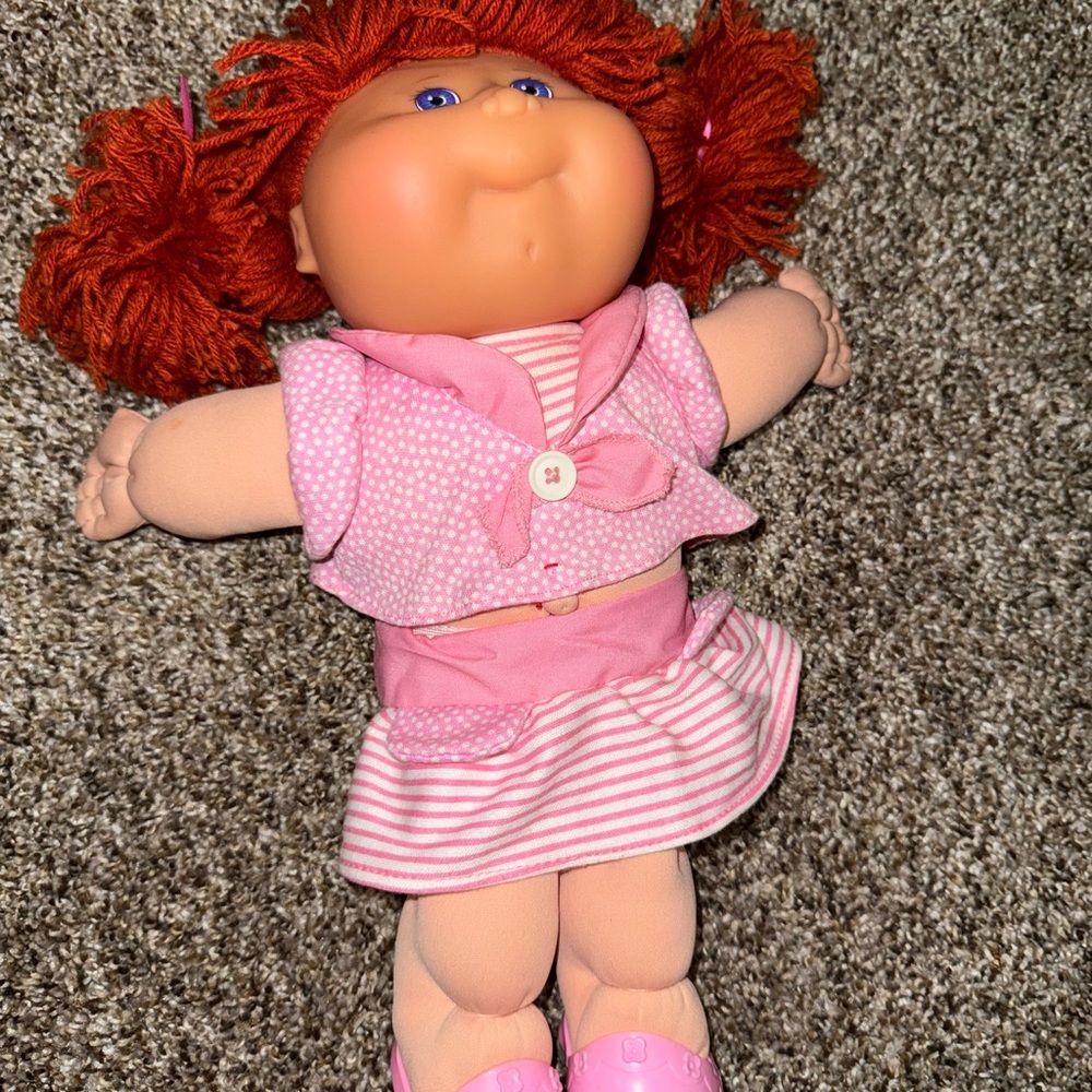 Charming Pink Doll with Red Hair